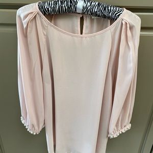 Light pink blouse with pearl detailing